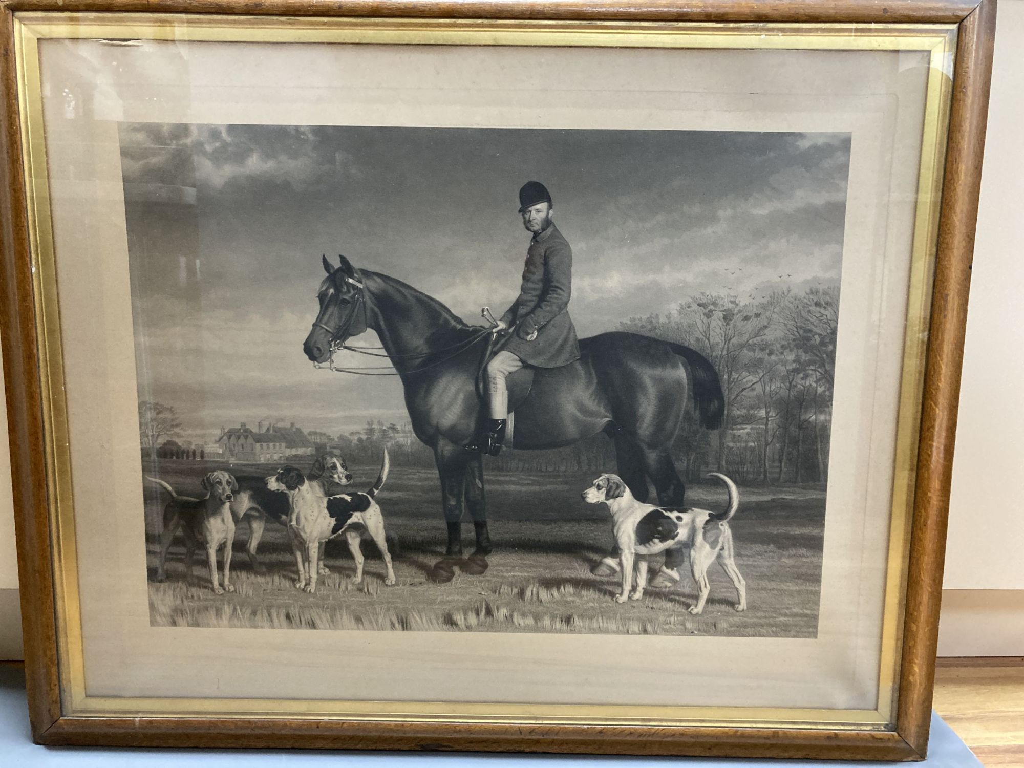 A Victorian maple framed engraving of a huntsman and hounds, 68 x 86cm